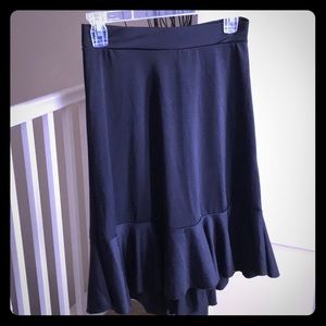 Black high-low knee length skirt. Spandex.